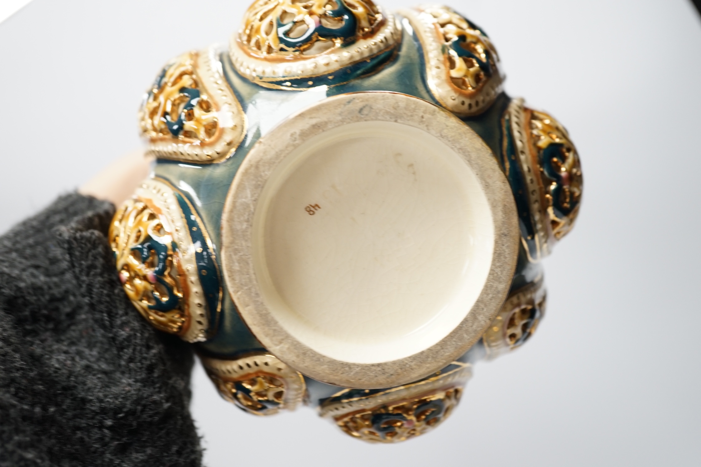 Hungarian pottery comprising pair of Zsolnay vases and covers, a pierced vase and a dish, 30cm high